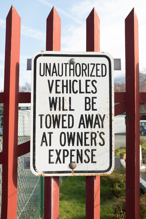 UNAUTHORIZED VEHICLES WILL BE TOWED AWAY AT OWNER'S EXPENCE sign.の写真素材