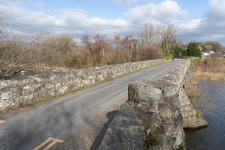 The old stone bridge across the river Seiont in Brynrefail Wales.