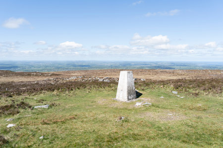 Trig point on Cefn Ddu, Lanberis, UK, with views over Anglesey.の写真素材