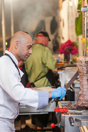 Cape Town, South Africa - November 13, 2016.Chef cutting Turkish meat.のeditorial素材