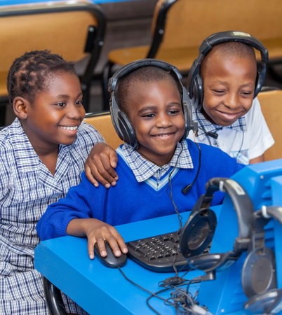 Johannesburg, South Africa, February 14, 2018: Kids looking at computer screen and learning about internet.のeditorial素材