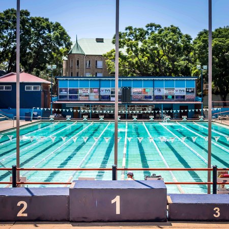 Pretoria, South Africa - March 6, 2018: Public swimming pool. Award platform in foreground.のeditorial素材