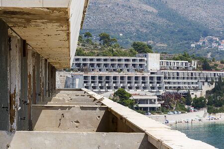 Taken from one of the balconies in Hotel Pelegrin, showing bullet holes in the walls, and the remains of Hotel Goricina 2 in the backgroundのeditorial素材