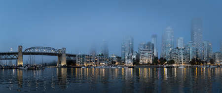 Vancouver, Canada - Circa 2020: Fog descends over downtown, obscuring buildings and giving the city a cold feelのeditorial素材