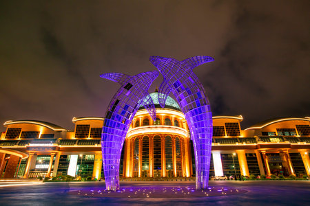 Stainless steel dolphin sculpture by the sea in Yantai, Chinaのeditorial素材