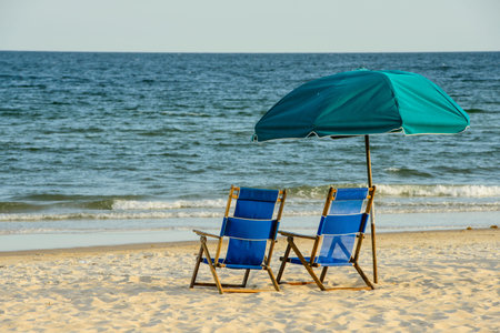 Beach chairs overlooking the oceanの写真素材