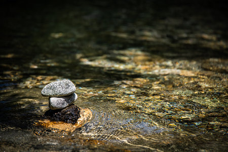 A Rock Tower in a Gentle Stream of a Creekの写真素材