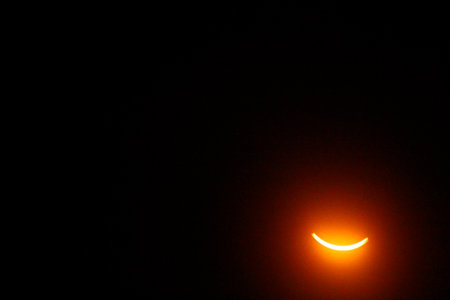 View of a Partial Solar Eclipse, After Third Contact, Sun Seen with Solar Filter, April 8, 2024, Dublin, Ohioの写真素材