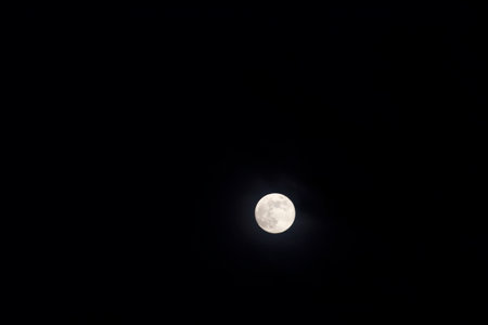 Full Moon Seen During an Early Eveningの写真素材
