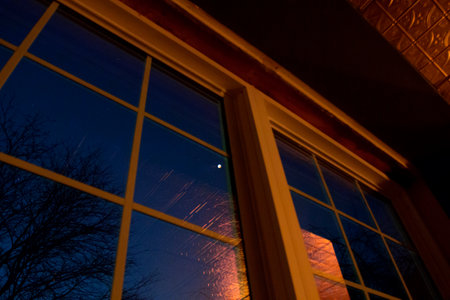 Looking at a Total Lunar Eclipse Through a Windowの写真素材