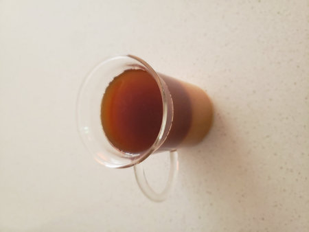 Coffee and Creamer Drink in a Transparent Glass Cup