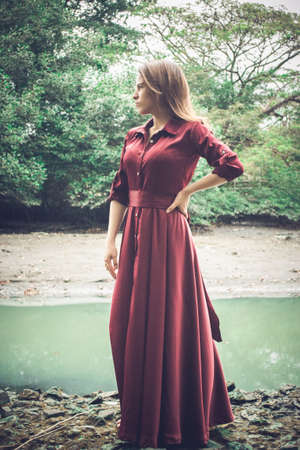 beautiful light-eyed woman in the parkの写真素材