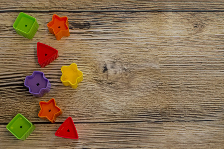 colorful shape on woody background
