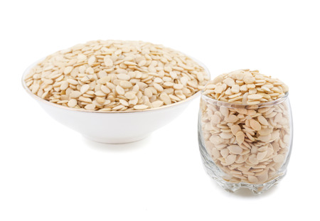 Shelled White Melon Seeds Isolated on White Backgroundの写真素材