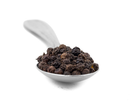 Organic Black Pepper in Spoon Also Know as Kali Mirch, Black Peppercorn, Indian Spice Isolated on...