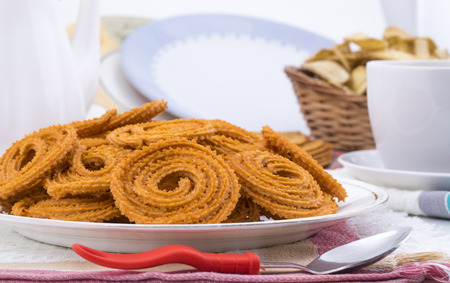 Indian Traditional Snack Chakli, a spiral shaped crisp deep fried snack, It is known as  Chakali, Murukku, Muruku, Murkoo, Chakri in Gujarat, Chakli in Maharashtra and Northern Indiaの写真素材