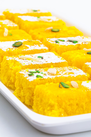 Indian Popular Sweet Food Khopara Pak or Coconut Burfi made up of Coconut, Milk And Sugar Isolated on White Backgroundの写真素材