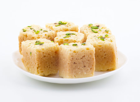Indian Traditional Famous Sweet Food Mysore Pak or Mysoor Pak Isolated on White Background