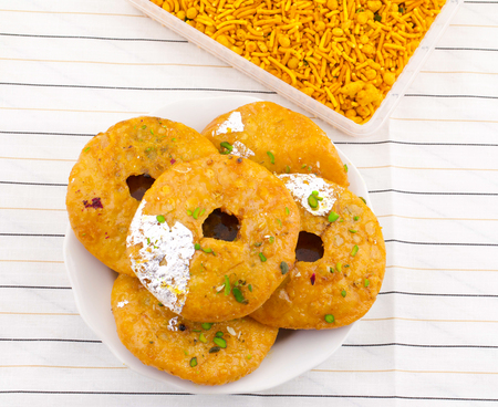 Indian Traditional Sweet Kachori Also Know As Mawa Kachori, Kachauri or Kachodi, Stuffed Kachori With Condensed Milk, Cheese and Dry Fruits And Served With Sugar Syrupの写真素材