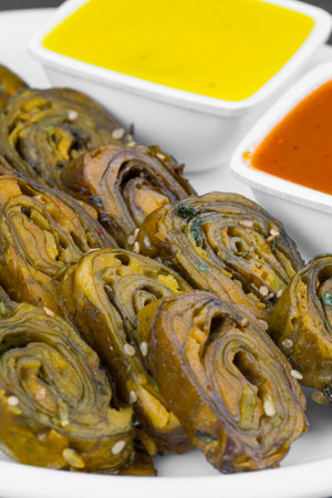 Indian Spicy Food Patra Also Called Paatra, Alu Vadi or Patrode is a Veg Dish in Maharashtra or...