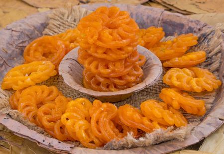 Indian Traditional Sweet Imarti Also Know as Amriti, Omriti, Jahangir, Jalebi, Jaangiri. It is Mde by Deep-Frying Vigna Mungo Flour Batter in a Kind of Circular Flower Shape.の写真素材