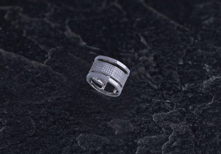 Sterling Silver Ring on Black Stone Background