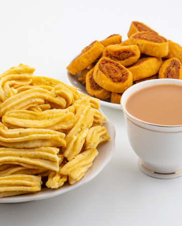 Indian Traditional Spicy Snack Ghatiya With Bhakarwadi Also Know as Ganthiya, Papdi, Gathiya, Bakarwadi, Bakarvadi, Bakar Vadi or Bakar Wadi Are Deep Fried Snack Made From Chickpea Flourの写真素材