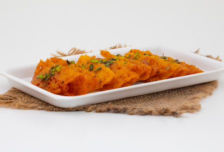 Indian Traditional Popular Sweet Food Malpua or Amalu on White Backgroundの写真素材