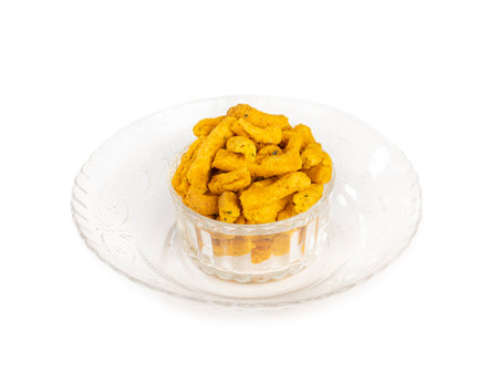 Indian Traditional Spicy Ganthiya or Gathiya, Gathia Are Deep Fried Namkeen Food on White Backgroundの写真素材
