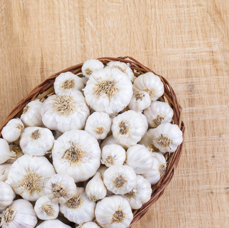 Pile of Fresh Organic Garlic on Vintage Wooden Backgroundの写真素材