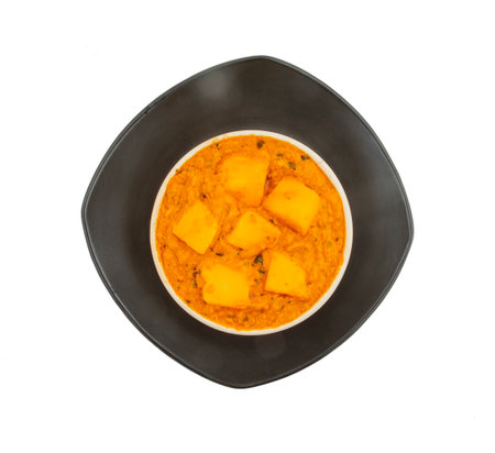 Indian Delicious Spicy Vegetarian Cuisine Paneer Toofani Also Know as Paneer Tufani, Toofani Paneer Masala or Dhaba Style Paneer Masala on isolated White Backgroundの写真素材