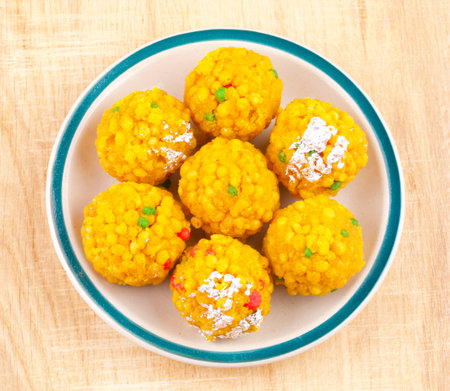 Laddu also know as laddoo, ladoo, laddo are ball-shaped sweets popular in the Indian festivals. Laddu are made of flour, minced dough and sugar with other ingredients.の写真素材