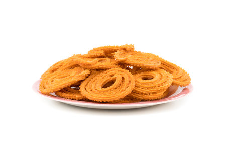 Indian Traditional Snack Chakli, a spiral shaped crisp deep fried snack, It is known as Chakali,...