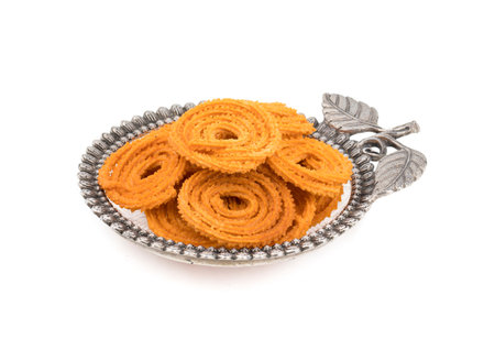 Indian Traditional Snack Chakli, a spiral shaped crisp deep fried snack, It is known as Chakali,...