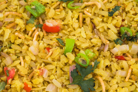 Indian Breakfast Dish Poha Also Know as Pohe or Aalu poha made up of Beaten Rice or Flattened Rice....