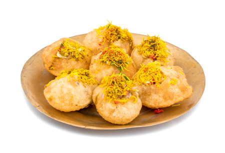 Indian Spicy Chaat Item Sev Puri Stuffed With Potato, Sev Namkeen, Coriander, Chutney isolated on...