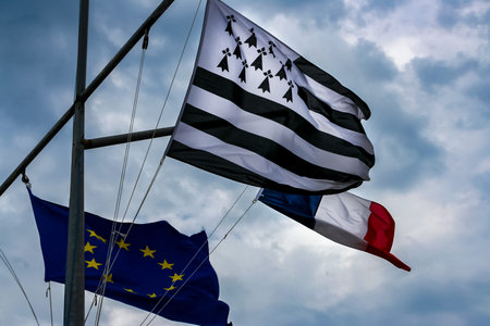 flags of france, britain and europe union with blue sky