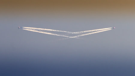 Airplane in the sky over the sea, closeup of photoの写真素材