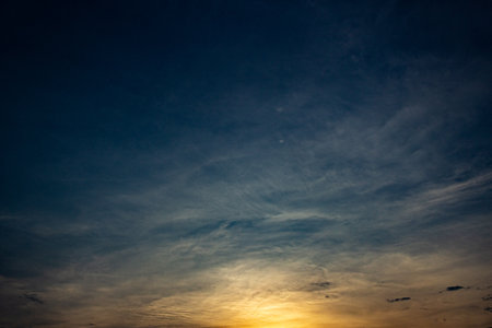 Sunset sky with cloud in twilight time. Natural background and texture.の写真素材