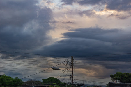 Dramatic sky with stormy clouds over the city, Thailand.の写真素材