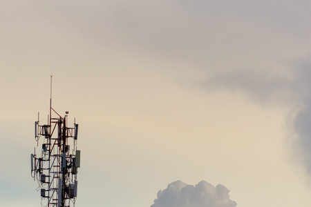 Telecommunication tower with blue sky and cloud, telecommunication technology background