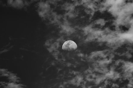 Moon and clouds in the sky. Noir et blanc. Copy space.の写真素材