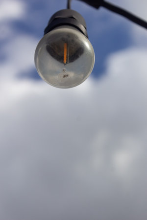 Lamp on the street with cloudy sky background, close-upの写真素材