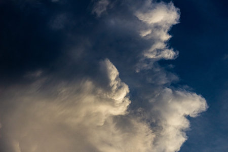 Clouds before a thunder-storm at sunset as an abstract background.