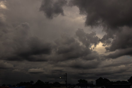 Dramatic stormy sky with dark clouds. Natural background.の写真素材