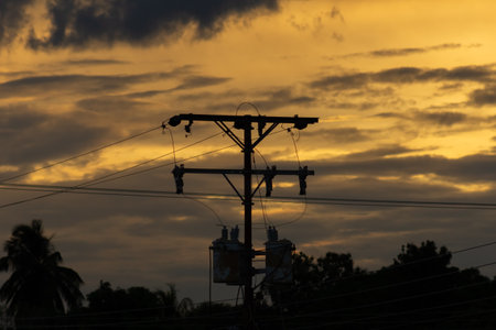 Electricity post in the evening sky at sunset, Chiang Mai, Thailand.の写真素材