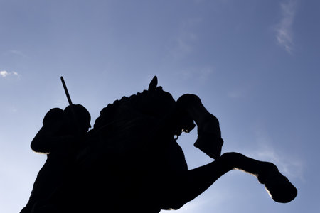 Silhouette of a man on horseback against the blue skyの写真素材