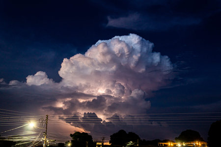 Stormy sky with thunderstorm and lightning in the night. Nature background.