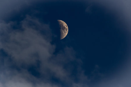 The moon in the dark blue sky with clouds, beautiful photo digital pictureの写真素材