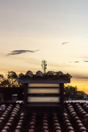 Silhouette of the temple roof at sunset in the evening.の写真素材